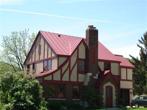 smal red house with metal roof|colonial red roof.